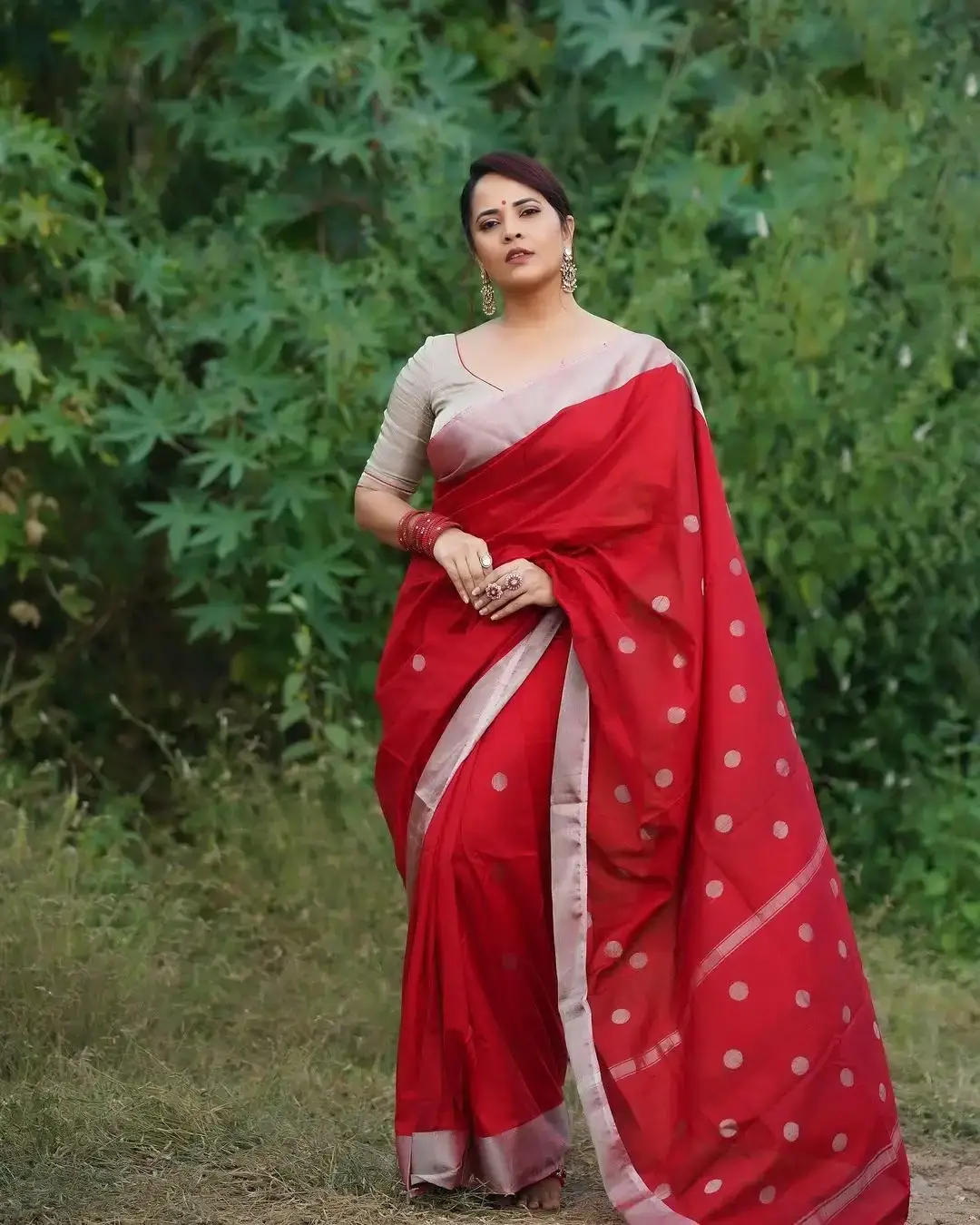 Anasuya Bharadwaj Jewellery Bangles Earrings Red Saree